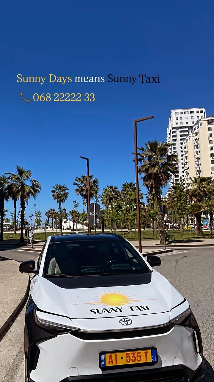 Sunny Taxi on the palm-lined Durrës promenade